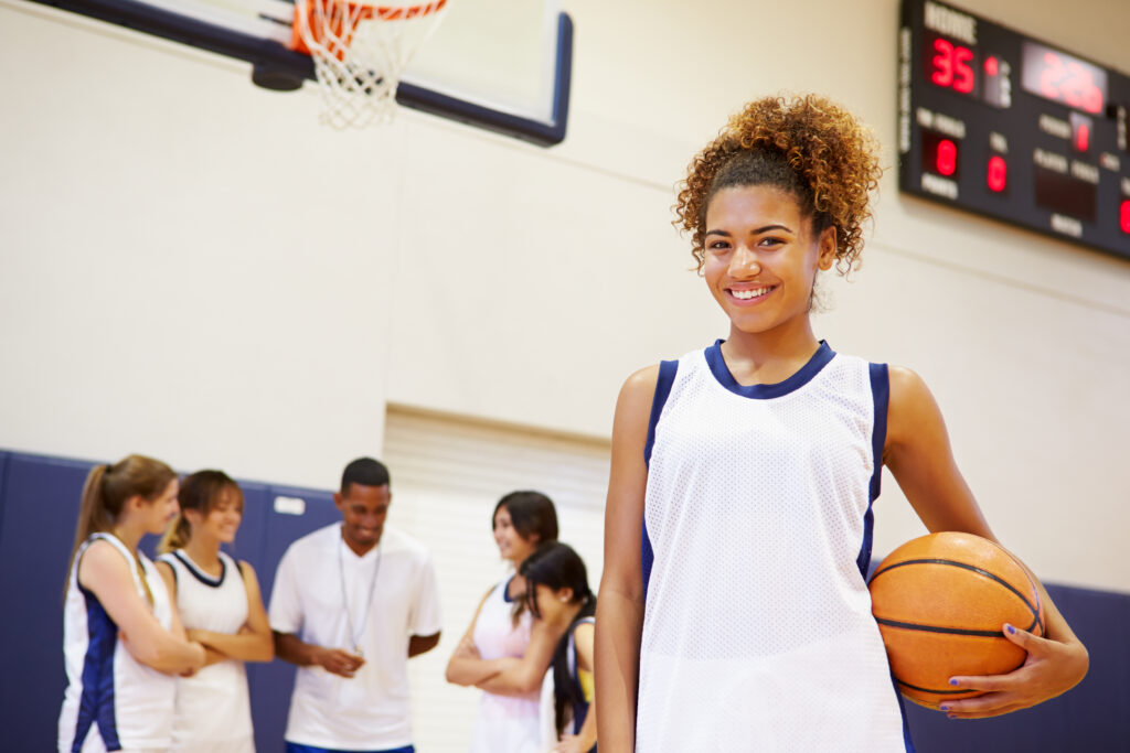 Portrait Of Female High School Basketball Player Smiling
