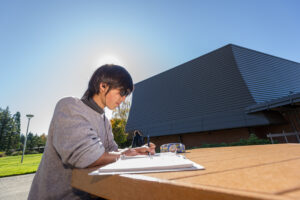 Student studying in the sunlight
