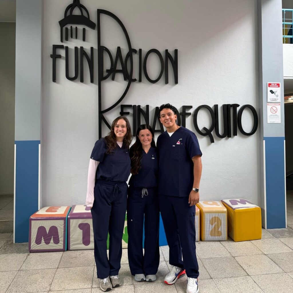 Photo of three nursing students posing indoors. 