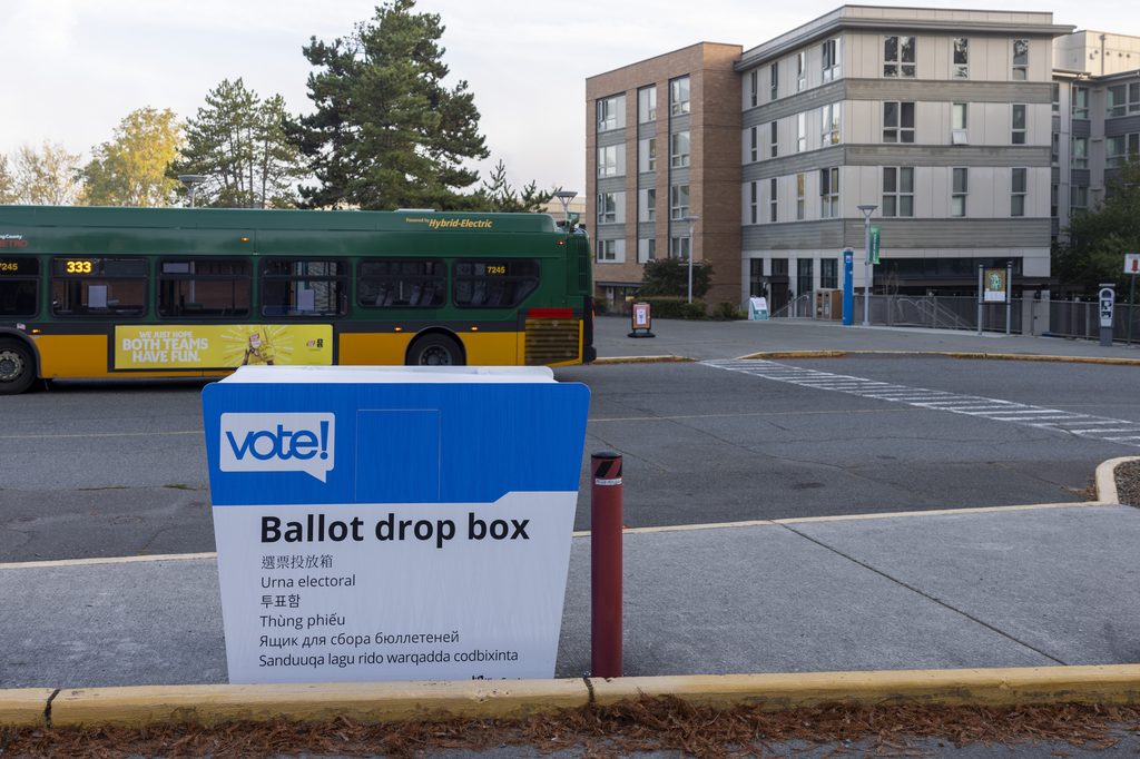 Photo of the ballot box with the residence hall in the background.
